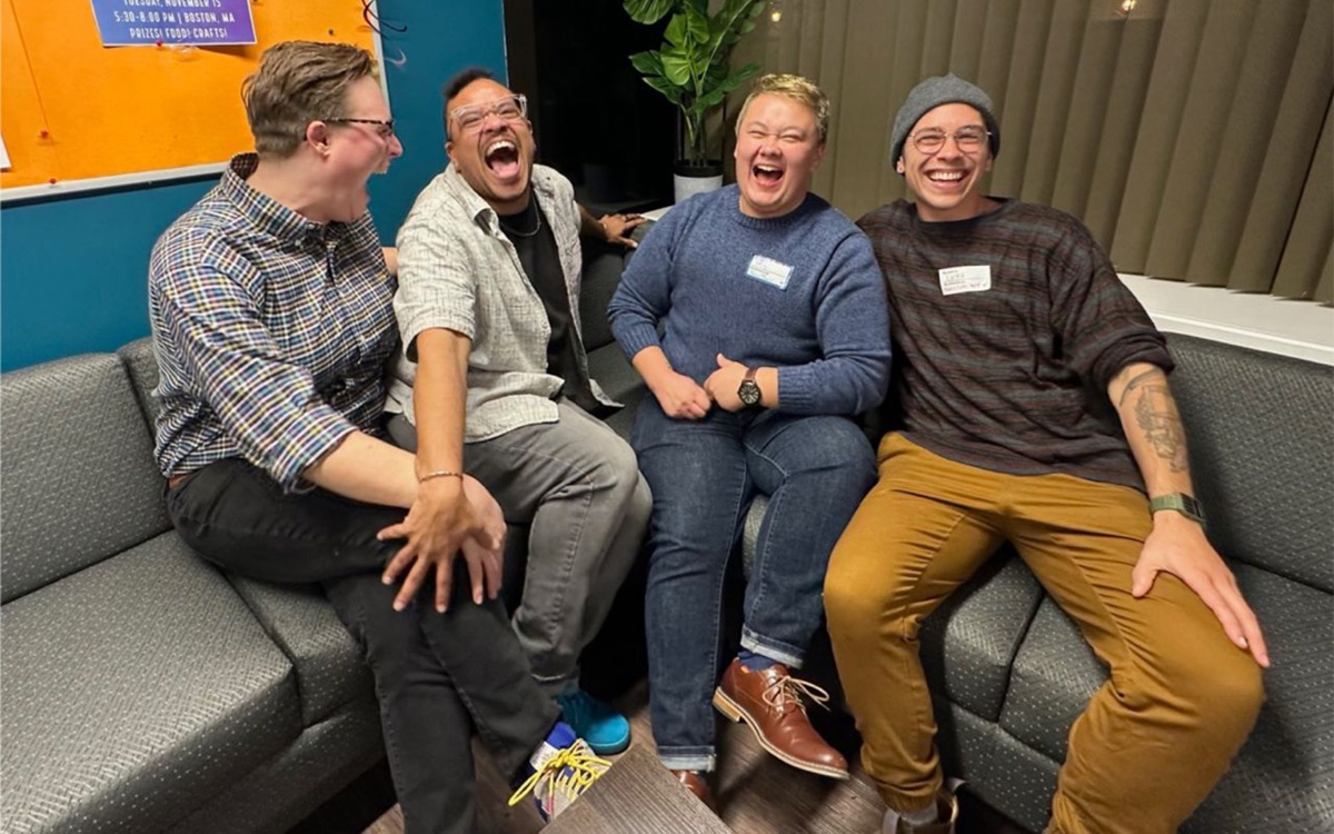 Kelsey Grunstra, Tre’Andre Carmel Valentine, MG Xiong, and Luke Lennon sit on a couch and smile